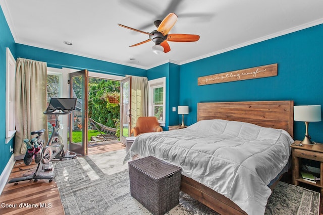 bedroom with crown molding, wood finished floors, access to exterior, baseboards, and ceiling fan