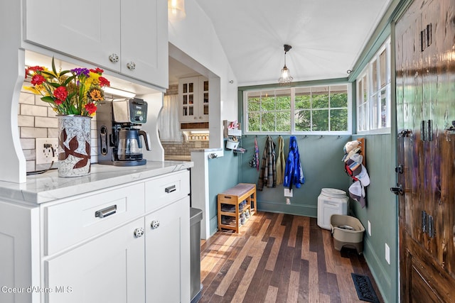 mudroom featuring baseboards, dark wood-style floors, and visible vents