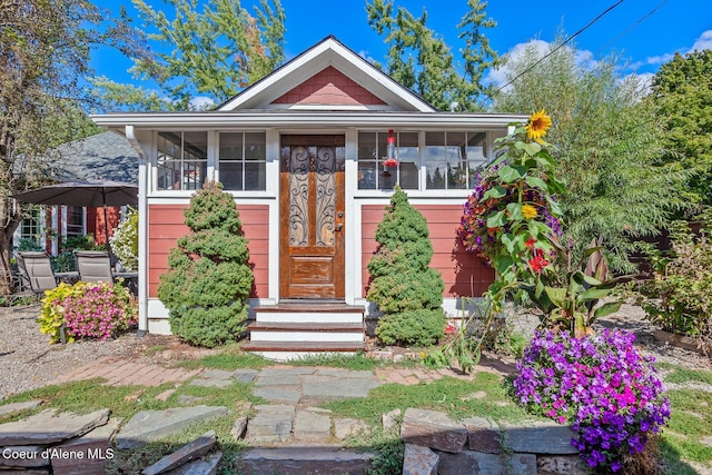 bungalow featuring a sunroom