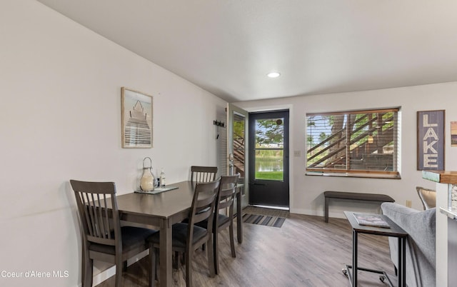 720 N 3rd Ave Unit 12, Sandpoint, ID 83864 - dining room featuring baseboards, wood finished floors, and recessed lighting