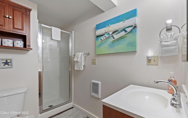 720 N 3rd Ave Unit 12, Sandpoint, ID 83864 - full bathroom with a shower stall, toilet, baseboards, and vanity