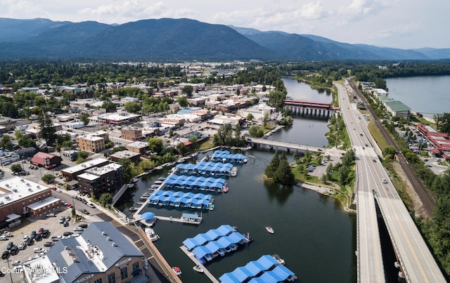 720 N 3rd Ave Unit 12, Sandpoint, ID 83864 - drone / aerial view of a main thoroughfare, a notable bridge, and a water and mountain view