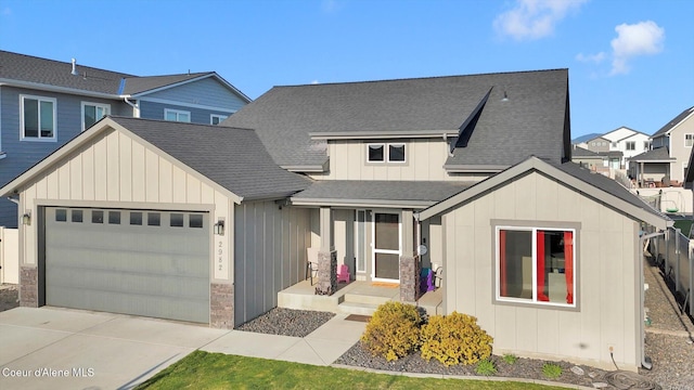 2982 N Bygone Way, Post Falls, ID 83854 - view of front of home featuring a garage, board and batten siding, driveway, and a shingled roof