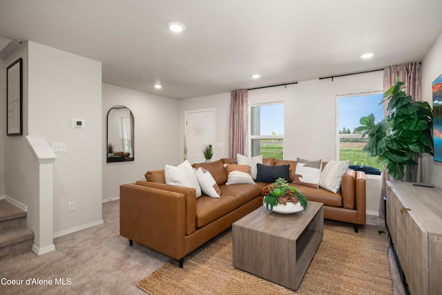 120 E Spirea Ln, Hayden, ID 83835 - living area featuring baseboards, recessed lighting, stairs, and light colored carpet