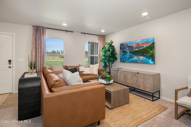 120 E Spirea Ln, Hayden, ID 83835 - living room featuring baseboards, recessed lighting, and light colored carpet