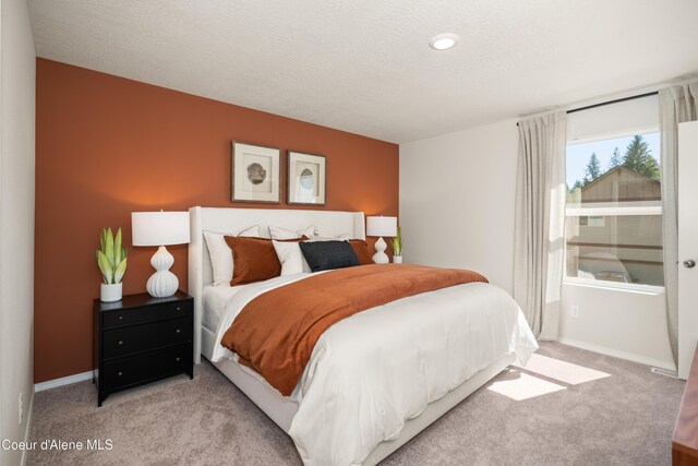 120 E Spirea Ln, Hayden, ID 83835 - bedroom featuring baseboards and carpet flooring