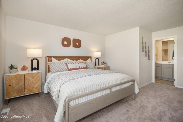 120 E Spirea Ln, Hayden, ID 83835 - carpeted bedroom featuring baseboards and a textured ceiling