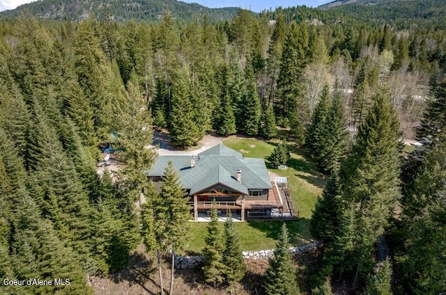 bird's eye view with a view of trees and a mountain view