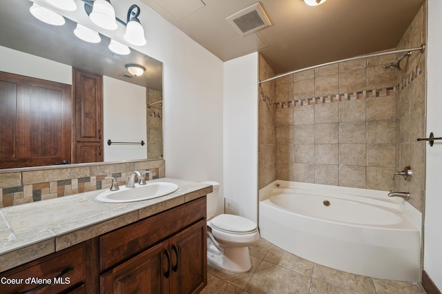 full bath featuring visible vents, decorative backsplash, vanity, shower / bathtub combination, and toilet
