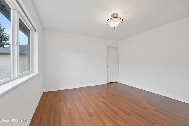 956 N Armstrong Dr, Coeur Dalene, ID 83814 - unfurnished room with dark wood-style flooring and baseboards