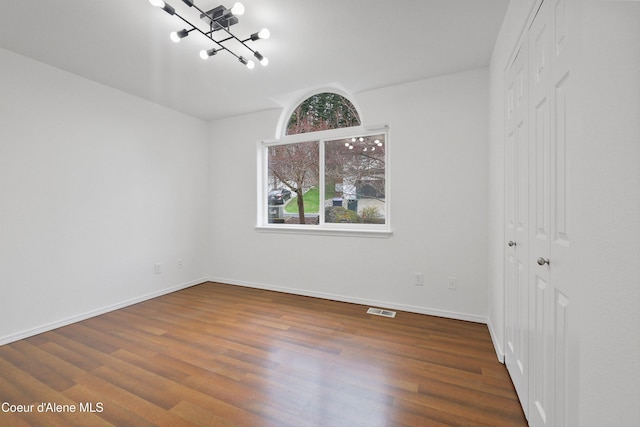 956 N Armstrong Dr, Coeur Dalene, ID 83814 - empty room with wood finished floors and baseboards