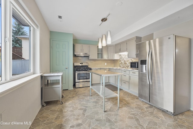956 N Armstrong Dr, Coeur Dalene, ID 83814 - kitchen featuring stainless steel appliances, stone flooring, light countertops, and tasteful backsplash