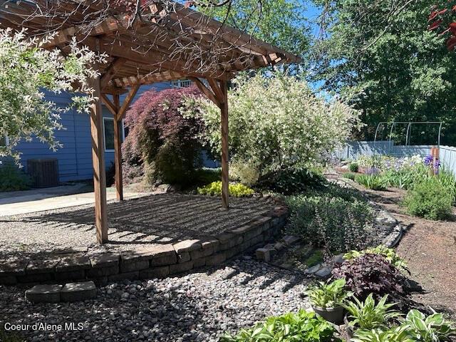 956 N Armstrong Dr, Coeur Dalene, ID 83814 - view of yard featuring a pergola