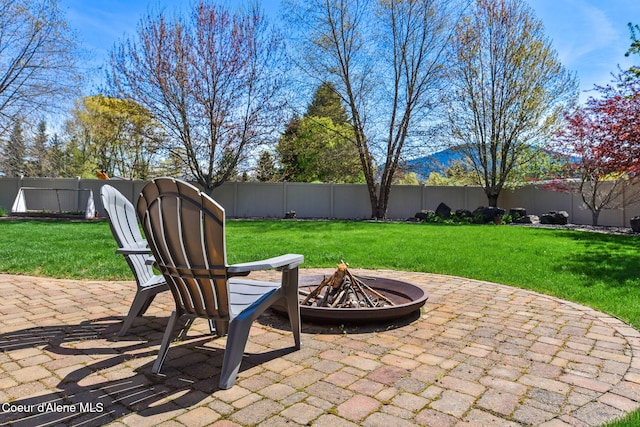 9024 N Baldwin Ct, Hayden, ID 83835 - view of patio with a fenced backyard and a fire pit
