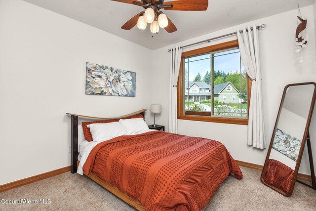 9024 N Baldwin Ct, Hayden, ID 83835 - carpeted bedroom with baseboards and a ceiling fan