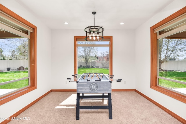9024 N Baldwin Ct, Hayden, ID 83835 - rec room featuring plenty of natural light and carpet flooring