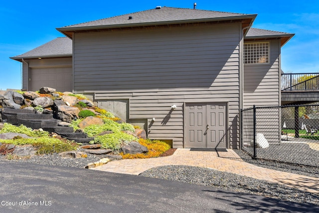 9024 N Baldwin Ct, Hayden, ID 83835 - view of property exterior with an attached garage and fence