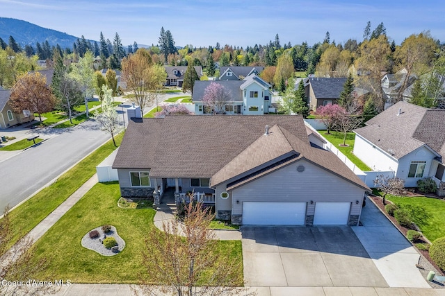 birds eye view of property with a residential view