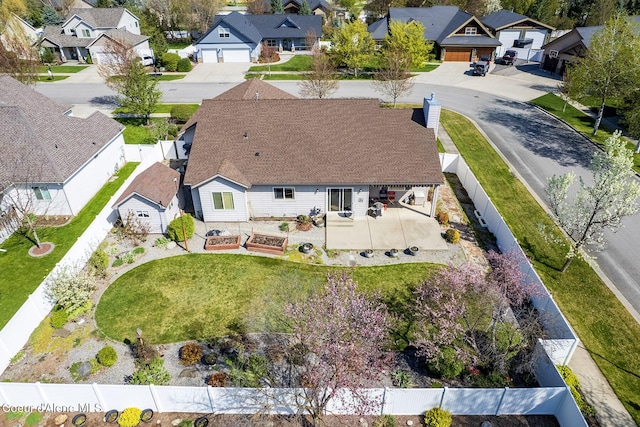 birds eye view of property with a residential view