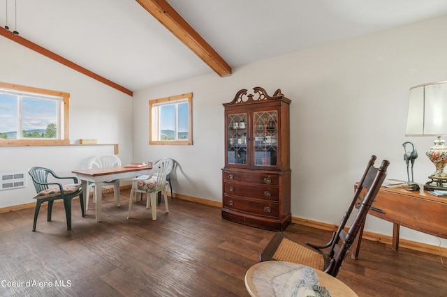 dining room with lofted ceiling with beams, baseboards, wood finished floors, and visible vents