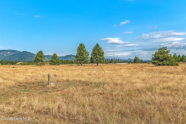 mountain view featuring a rural view