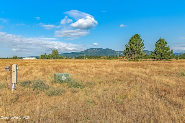 property view of mountains featuring a rural view