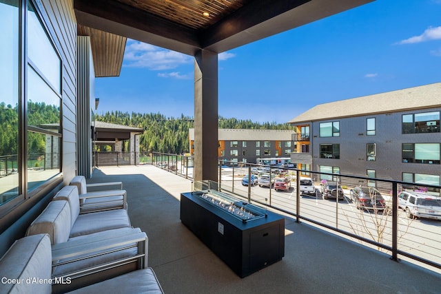 3132 N Atlas Rd, Coeur Dalene, ID 83814 - view of patio / terrace featuring a fire pit and a balcony