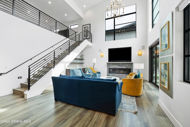 3132 N Atlas Rd, Coeur Dalene, ID 83814 - living room featuring baseboards, wood finished floors, a wealth of natural light, and stairway