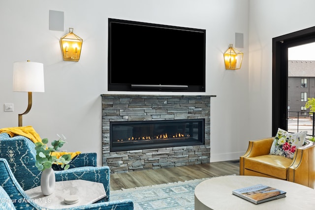 3132 N Atlas Rd, Coeur Dalene, ID 83814 - living area with beverage cooler, wood finished floors, and a fireplace