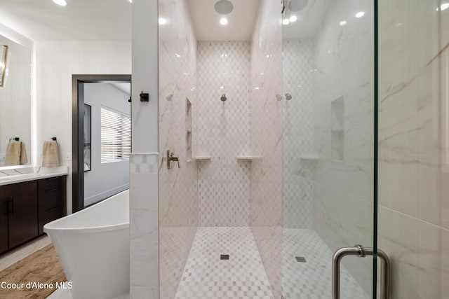 3132 N Atlas Rd, Coeur Dalene, ID 83814 - bathroom featuring a soaking tub, recessed lighting, vanity, and a stall shower