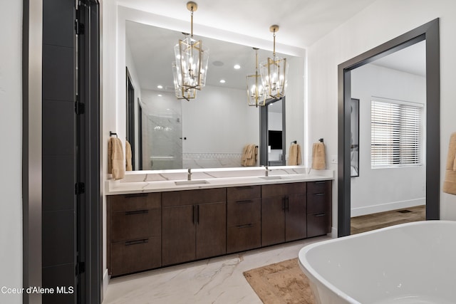3132 N Atlas Rd, Coeur Dalene, ID 83814 - bathroom featuring double vanity, recessed lighting, a chandelier, a freestanding tub, and marble finish floor