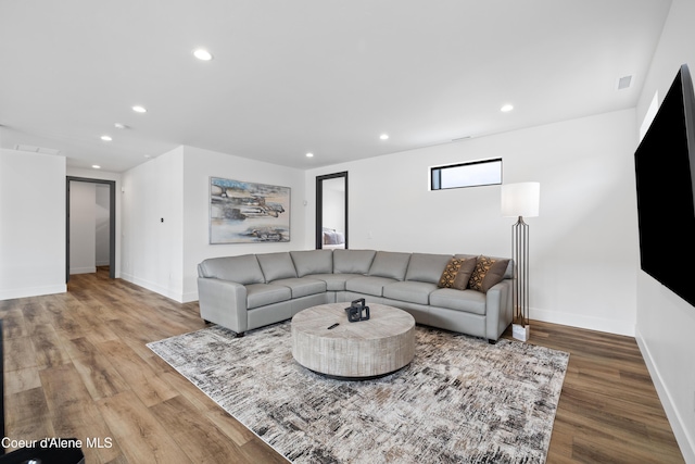 3132 N Atlas Rd, Coeur Dalene, ID 83814 - living area with visible vents, baseboards, wood finished floors, and recessed lighting