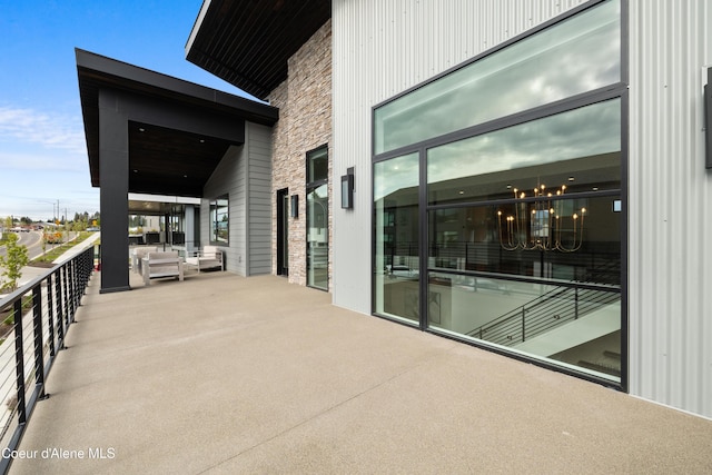 3132 N Atlas Rd, Coeur Dalene, ID 83814 - view of patio featuring an outdoor hangout area and a balcony