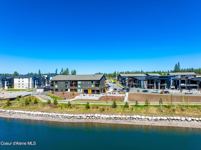 3132 N Atlas Rd, Coeur Dalene, ID 83814 - rear view of house featuring a residential view and a water view