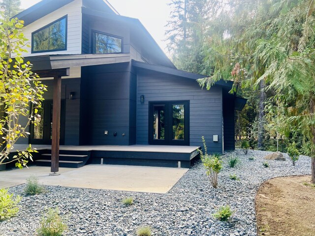70 Wedge Ct, Priest Lake, ID 83856 - rear view of property with french doors