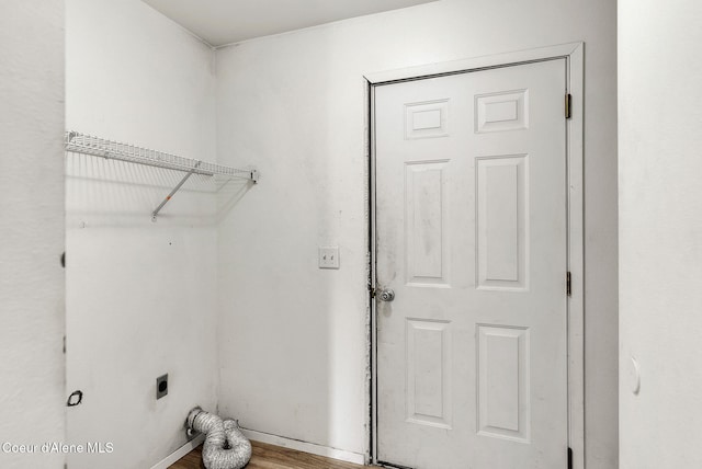 1002 E St Elias Ct, Post Falls, ID 83854 - laundry room featuring electric dryer hookup, wood finished floors, and laundry area