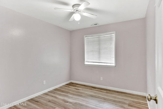1002 E St Elias Ct, Post Falls, ID 83854 - empty room featuring visible vents, ceiling fan, light wood-style flooring, and baseboards