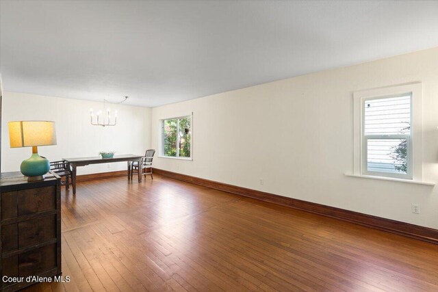 917 E Young Ave, Coeur Dalene, ID 83814 - living room with a chandelier, hardwood / wood-style flooring, and baseboards