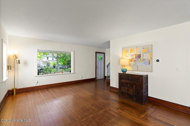 917 E Young Ave, Coeur Dalene, ID 83814 - unfurnished living room with hardwood / wood-style flooring and baseboards