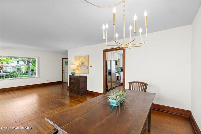 917 E Young Ave, Coeur Dalene, ID 83814 - dining room with a chandelier, baseboards, and hardwood / wood-style flooring