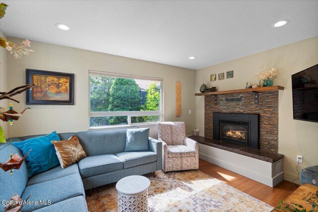 917 E Young Ave, Coeur Dalene, ID 83814 - living area with wood finished floors, a stone fireplace, and recessed lighting