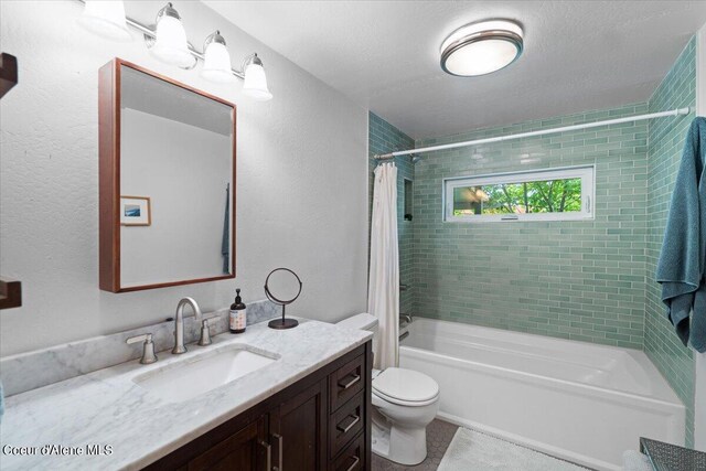 917 E Young Ave, Coeur Dalene, ID 83814 - full bathroom featuring shower / tub combo, vanity, toilet, and tile patterned floors