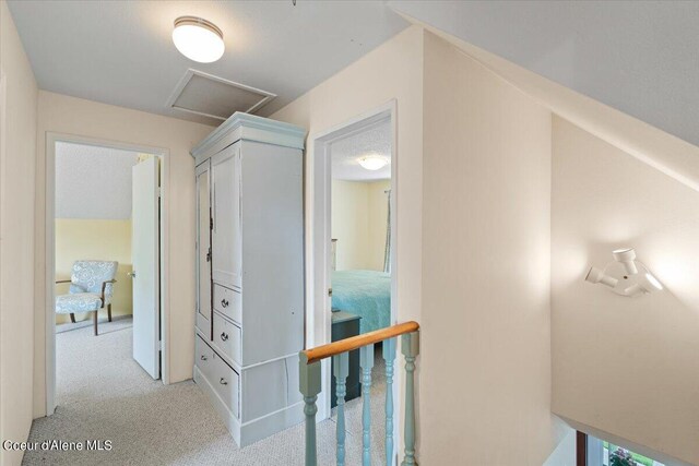 917 E Young Ave, Coeur Dalene, ID 83814 - hallway featuring attic access and light carpet