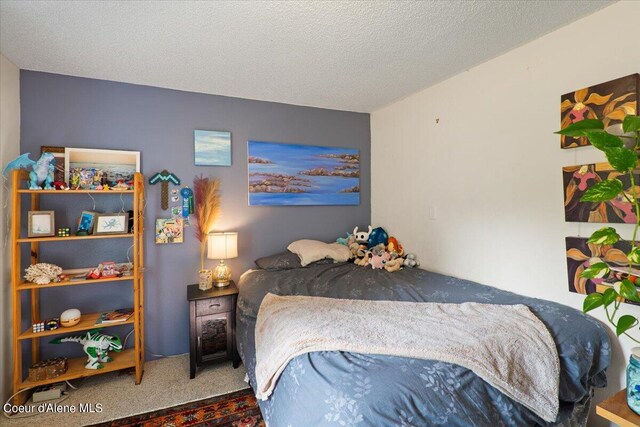 917 E Young Ave, Coeur Dalene, ID 83814 - bedroom featuring carpet and a textured ceiling