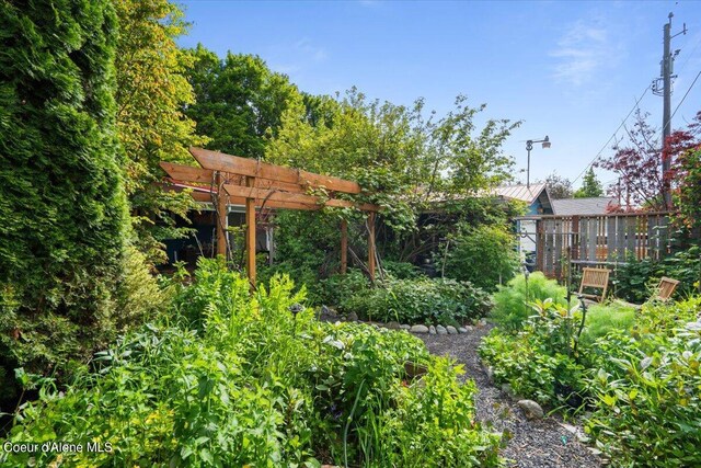 917 E Young Ave, Coeur Dalene, ID 83814 - view of yard featuring a pergola