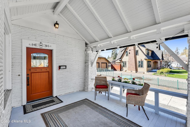 sunroom / solarium with beamed ceiling