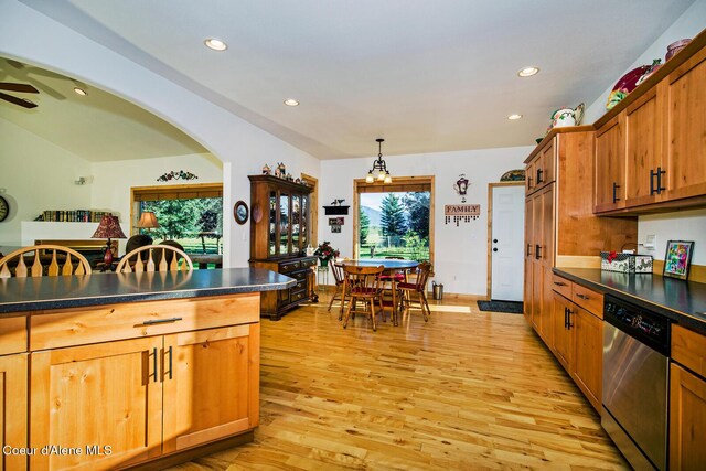 kitchen with dark countertops, dishwasher, recessed lighting, and plenty of natural light