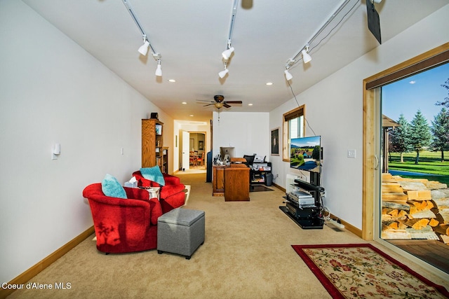 carpeted living area featuring track lighting, baseboards, recessed lighting, and a ceiling fan