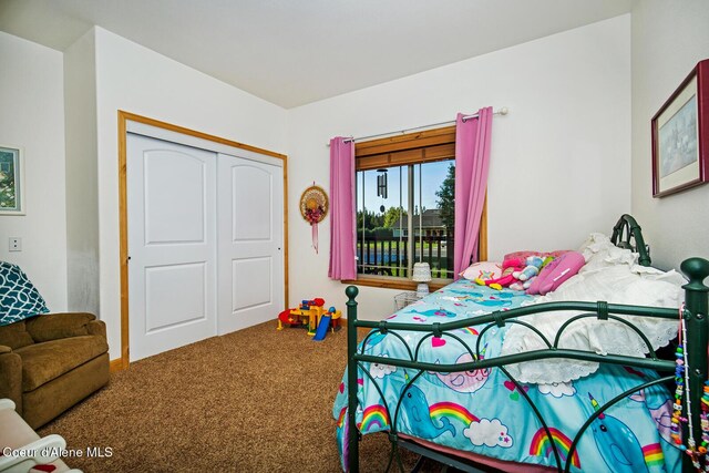 carpeted bedroom with a closet