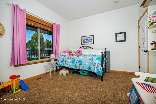 carpeted bedroom with baseboards